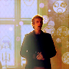 Twelfth Doctor lecturing with Gallifreyan symbols in the background.
