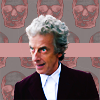 Twelve glaring in front of a grey-pink background with a skull pattern.