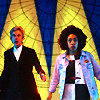 Bill and Twelve running towards foreground in front of a blue-yellow church window texture.